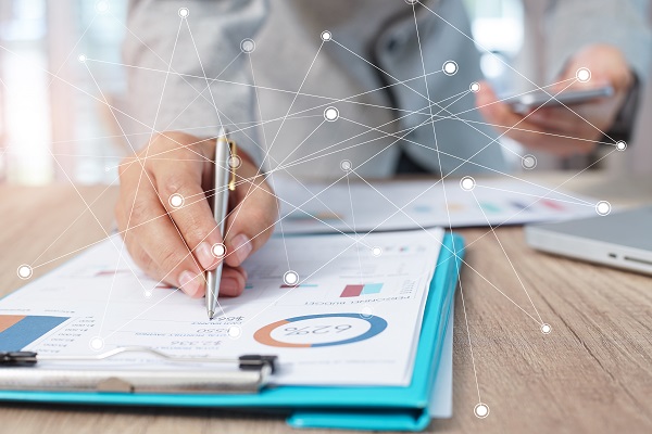 Businessman analyzing investment charts with laptop. Accounting